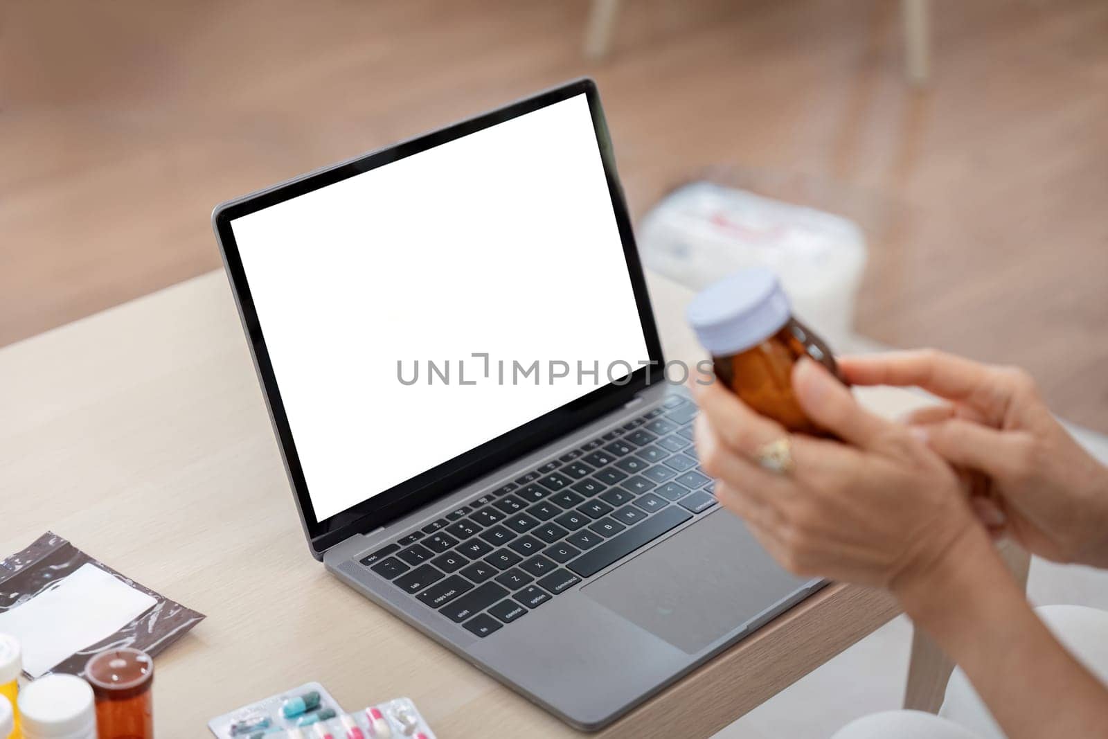 Elderly woman sit at home having online consultation with doctor on computer laptop, sick senior talk on video call consulting with nurse using laptop, healthcare concept.