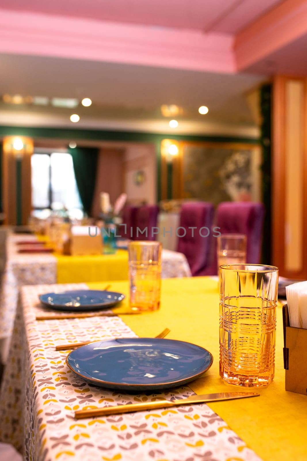 a laid table with a beautiful talelka and dishes in the restaurant.