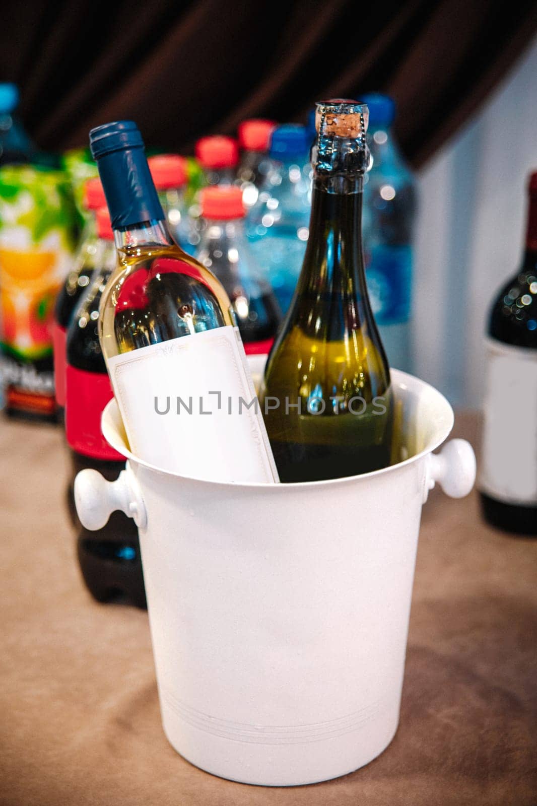 wine in a white bucket with ice in a cafe by Pukhovskiy