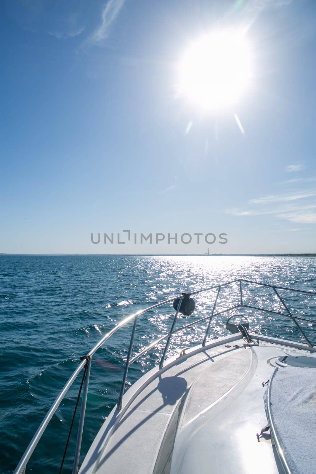 the side of the yacht at sea on a summer day.