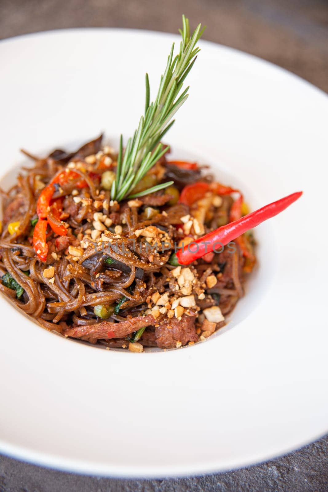 spaghetti pasta with red pepper and rosemary by Pukhovskiy