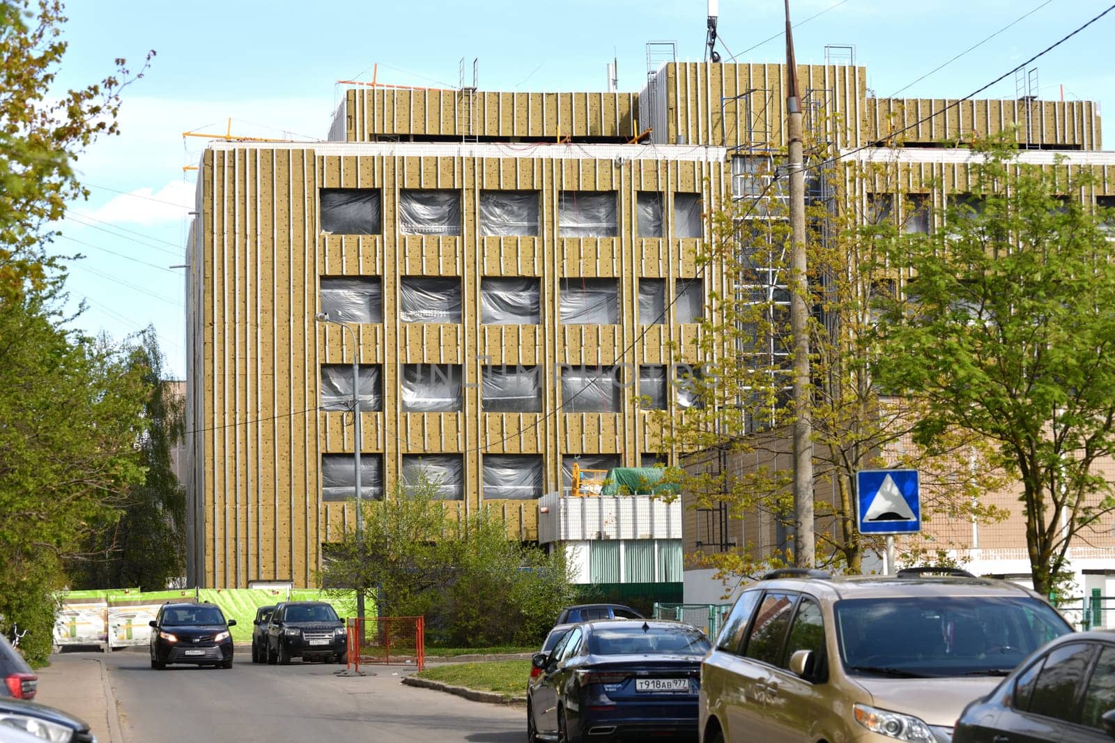Moscow, Russia - May 1. 2024. Building with facade insulated with mineral wool