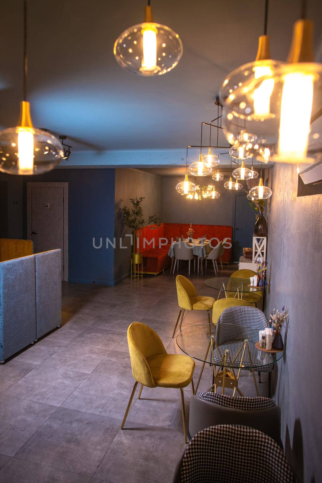 Elegant restaurant interior with dim lighting and stylish furniture by Pukhovskiy