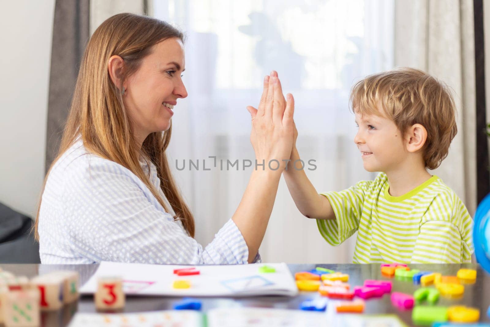 High Five in a Children's Educational Setting by andreyz