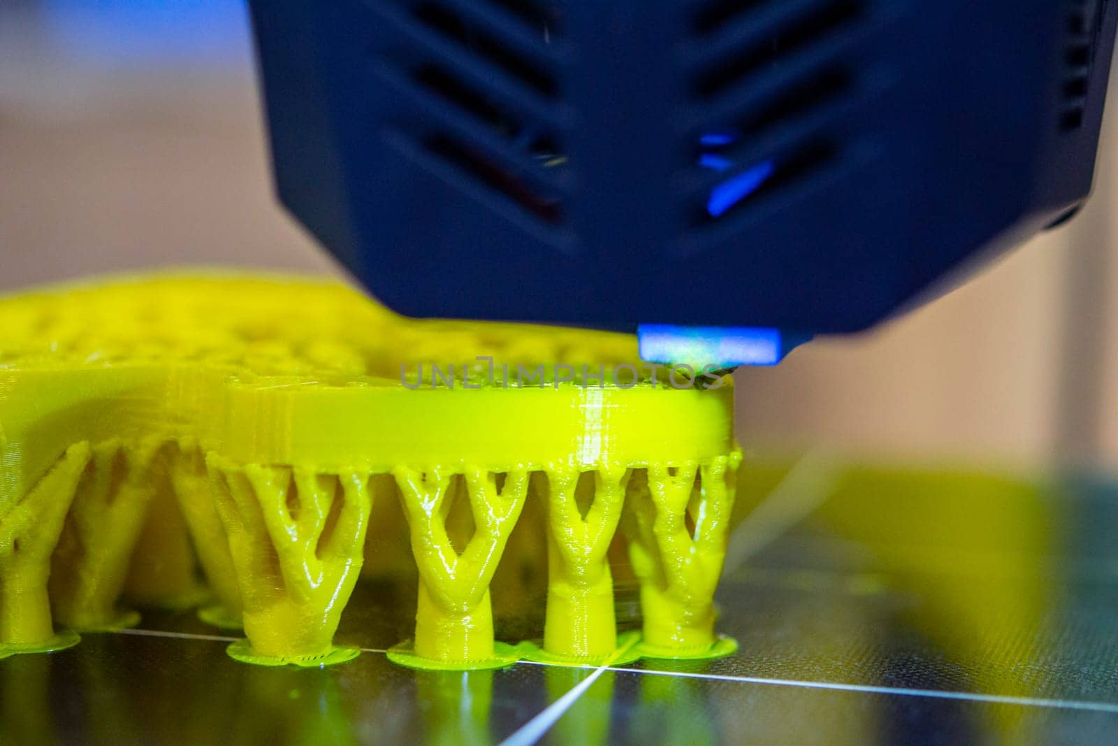 3D printer printing object close-up. Process creating three-dimensional model by Mari1408