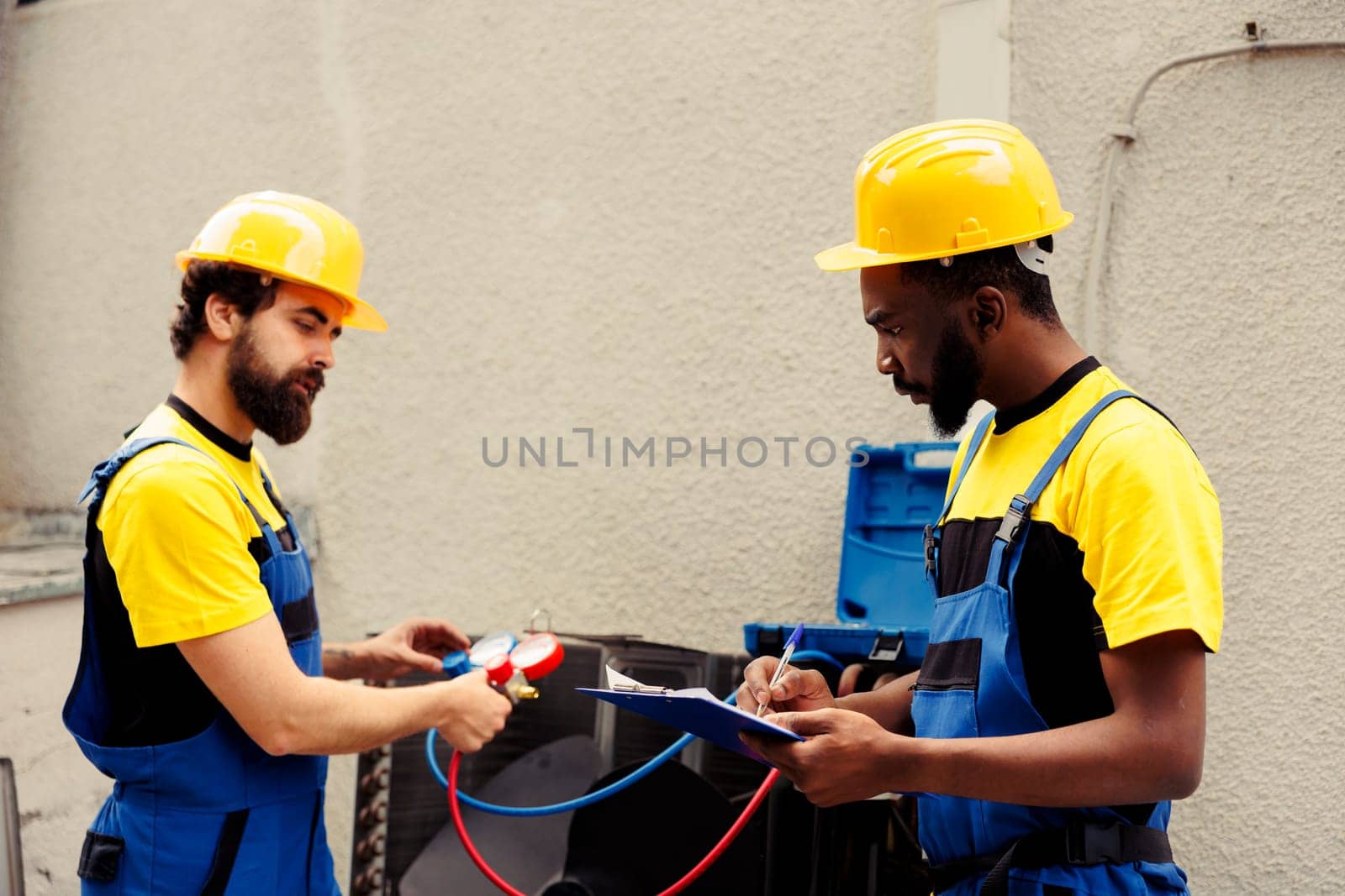 Engineers using manometers by DCStudio