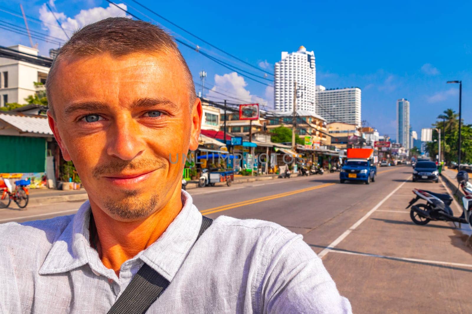 Man takes photo selfie in the city in Pattaya Bang Lamung Amphoe Chon Buri Thailand in Southeastasia Asia.