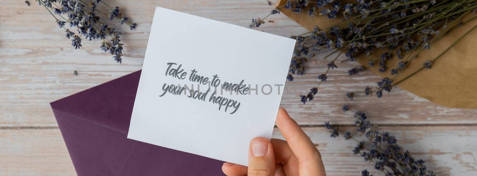 TAKE TIME TO MAKE YOUR SOUL HAPPY text on supportive message paper note reminder from green envelope. Flat lay composition dry lavender flowers. Concept of inner happiness, slowing-down digital detox personal fulfillment by anna_stasiia