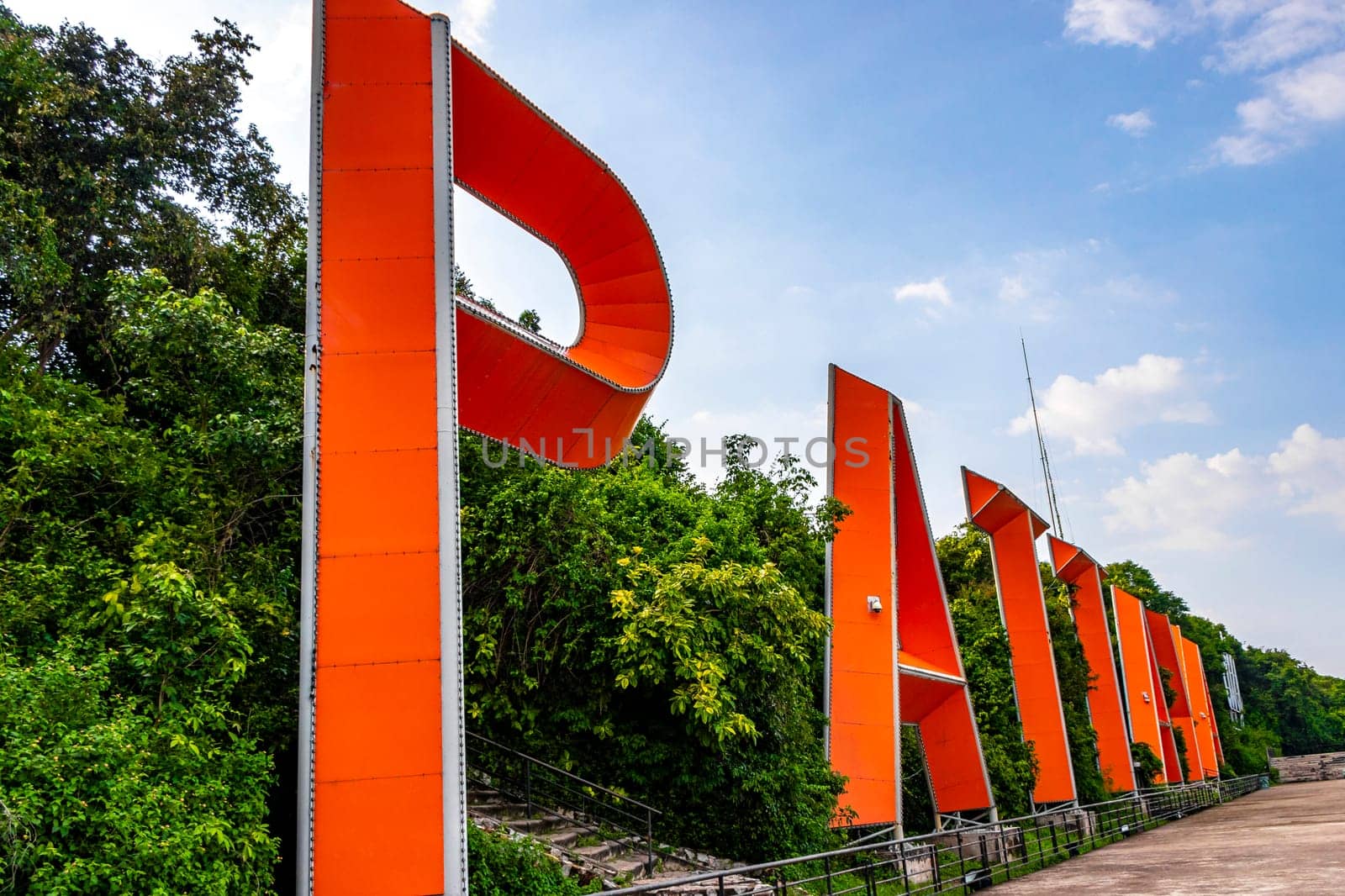 Pattaya City name sign lettering letters on hill in Thailand. by Arkadij