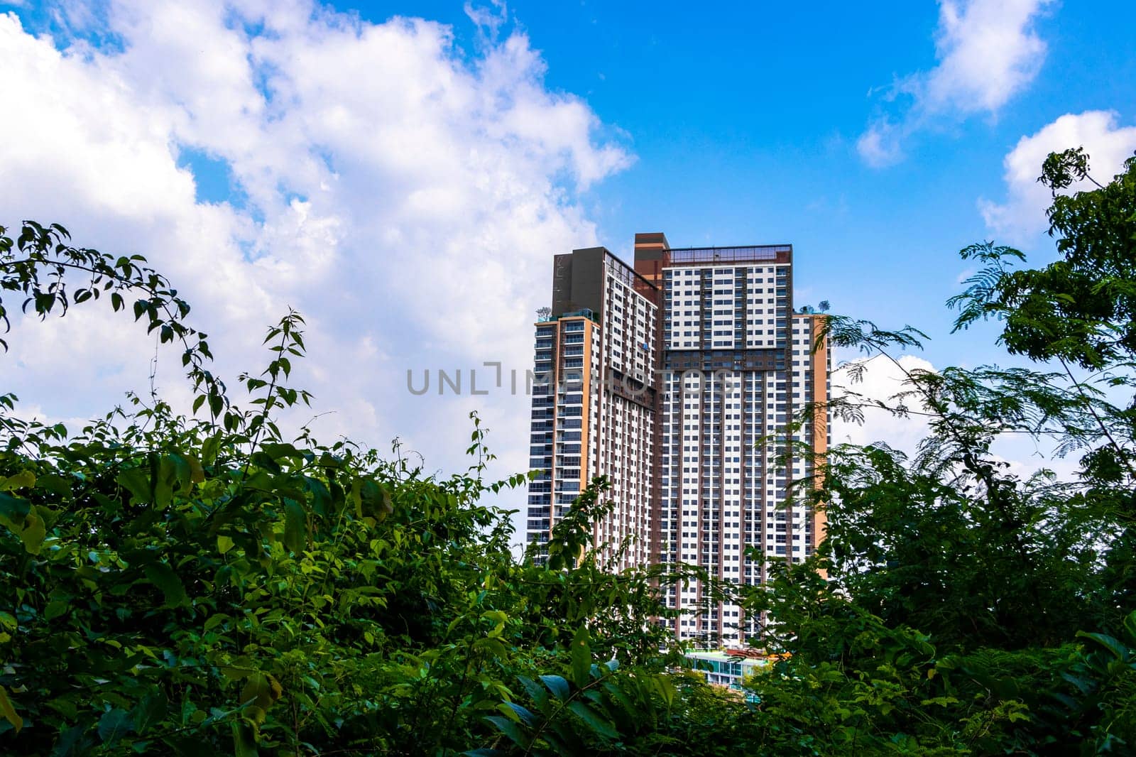 Highrise buildings skyscrapers streets city cityscape in Pattaya Thailand. by Arkadij