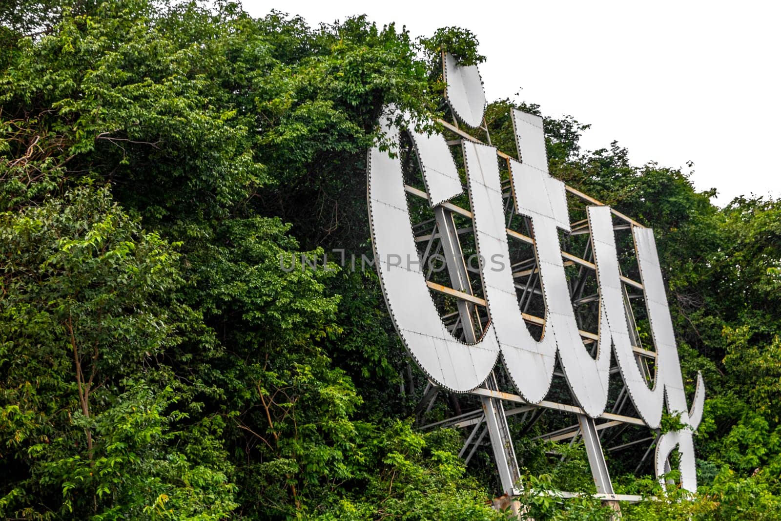 Pattaya City name sign lettering letters on hill in Thailand. by Arkadij