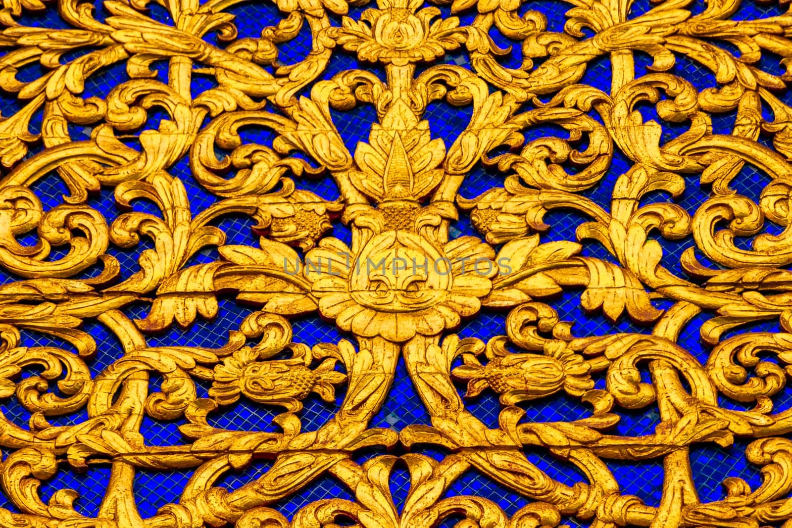 Details of colorful golden gold Wat Phra That Doi Suthep temple building wall texture in Chiang Mai Amphoe Mueang Chiang Mai Thailand in Southeastasia Asia.