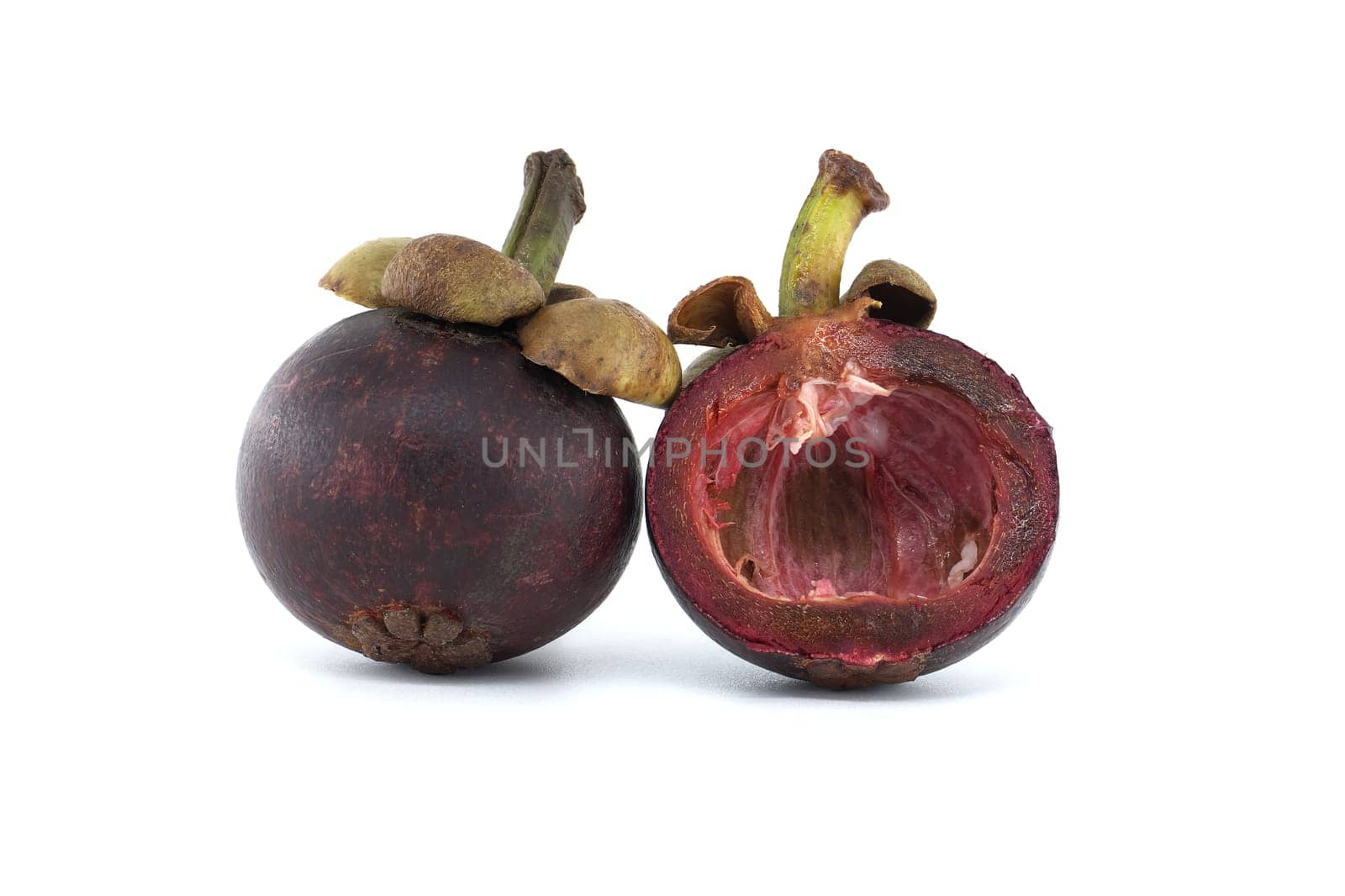 Purple mangosteen fruits isolated against a white background by NetPix