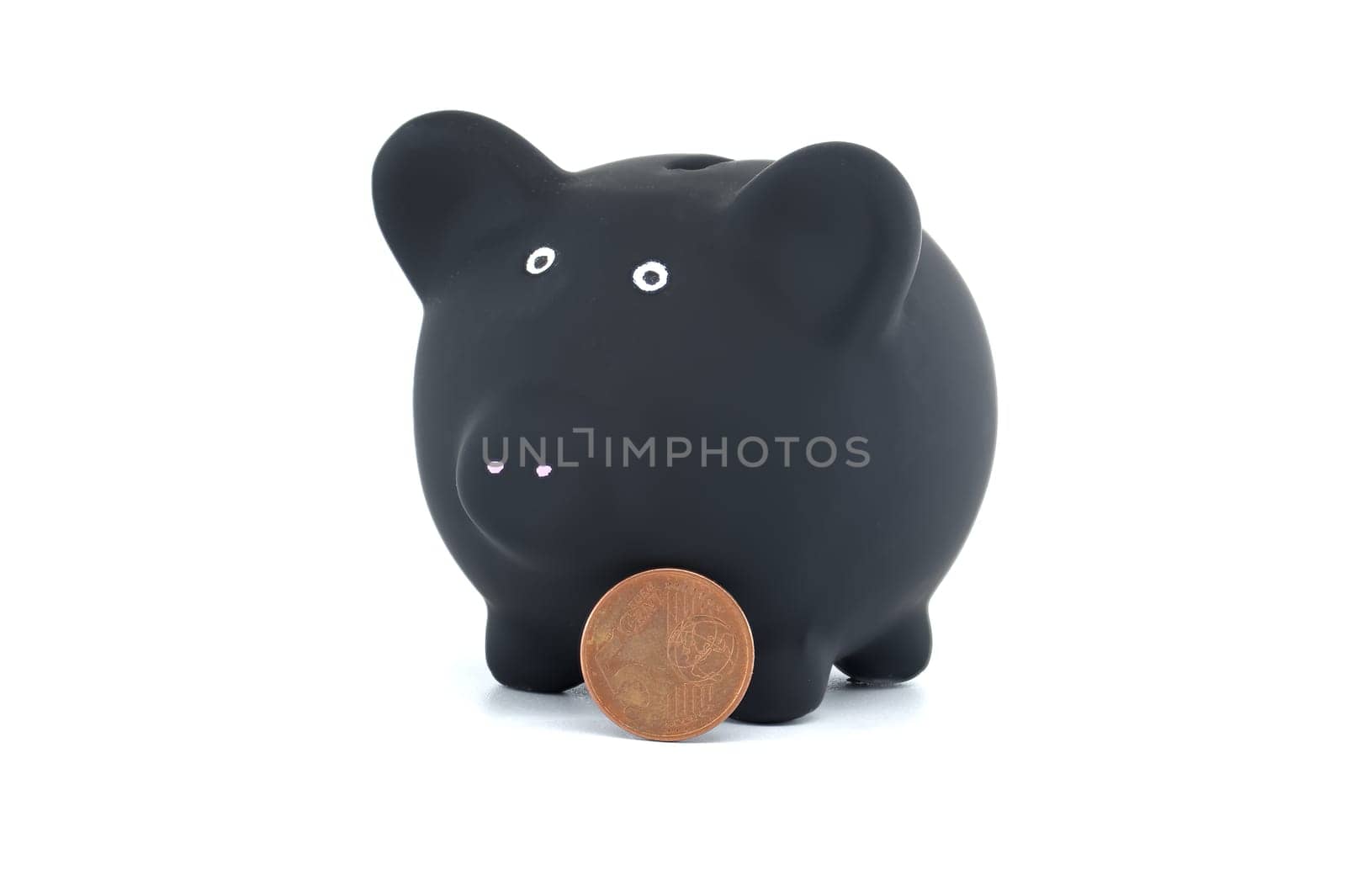 Black piggy bank and coins isolated on white background by NetPix