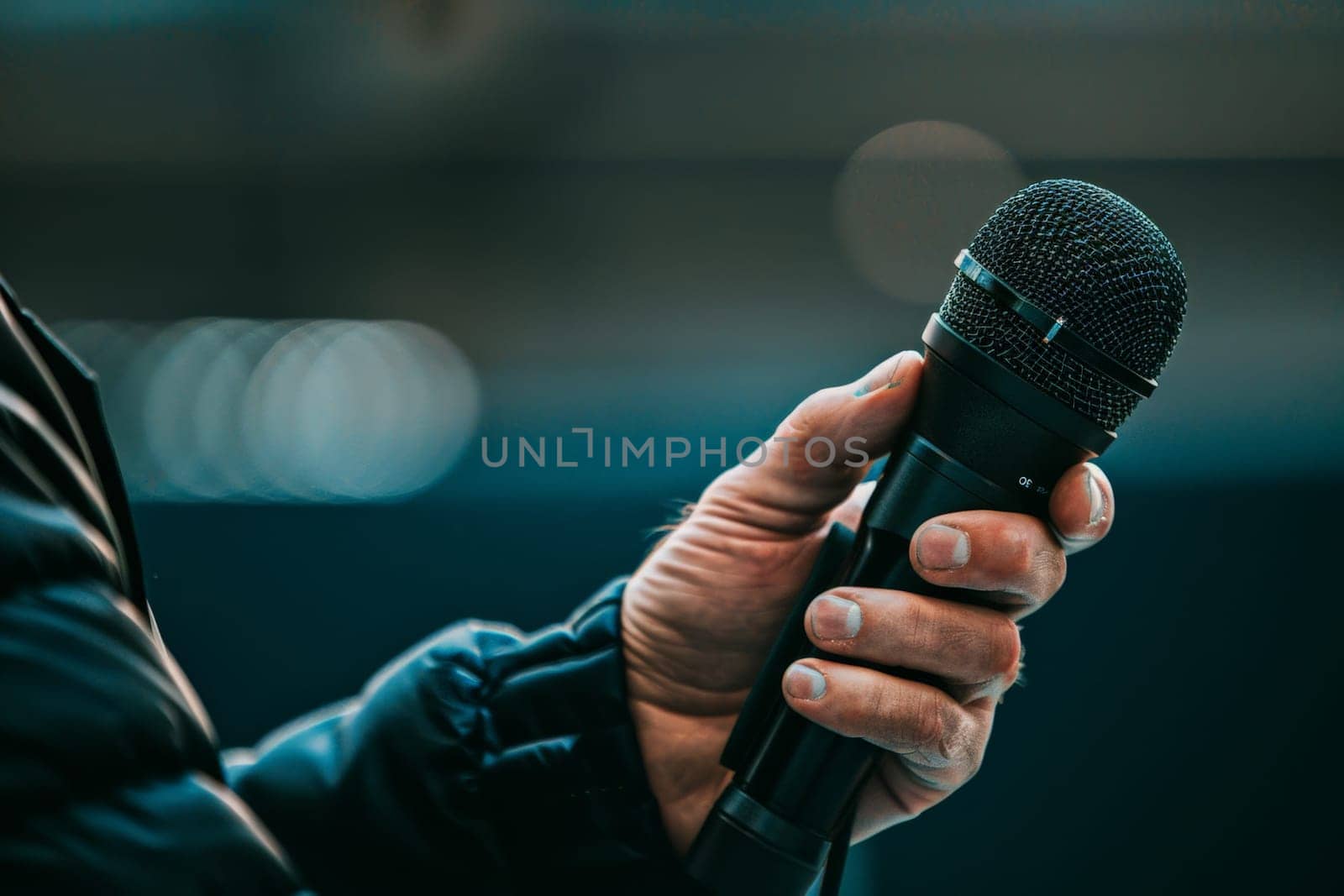 Man hands holding microphone on stand, Professional Media interview.