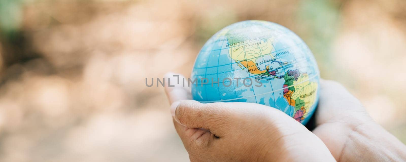Hold the Green Planet in Your Hands and Save Earth This concept for Environment and Earth Day signifies responsibility, wisdom, and global support for our natural world.