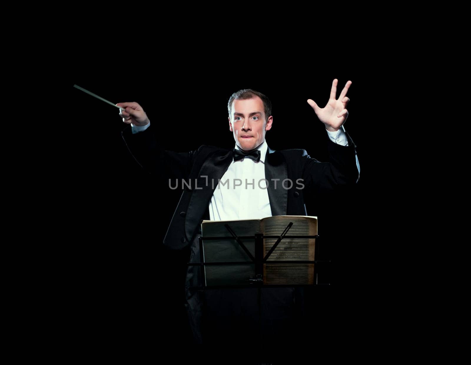 Shot of music director conducting with inspiration by rivertime