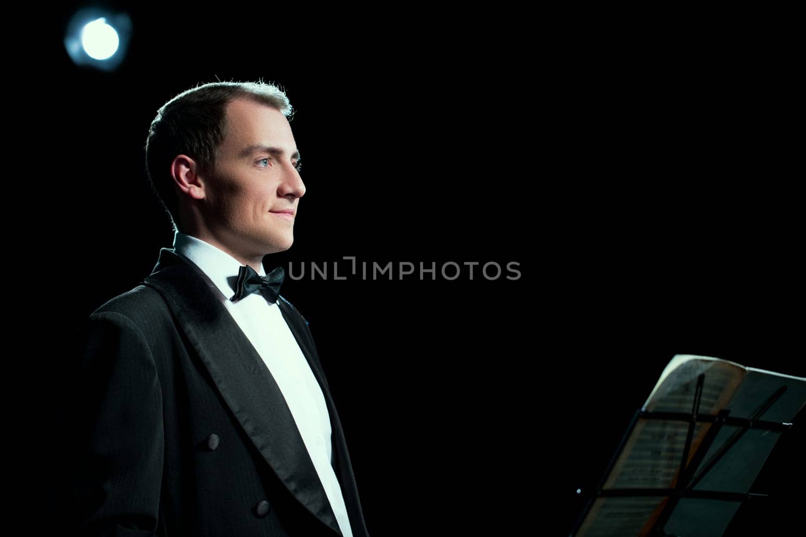 Studio photo of music conductor smiles public by rivertime