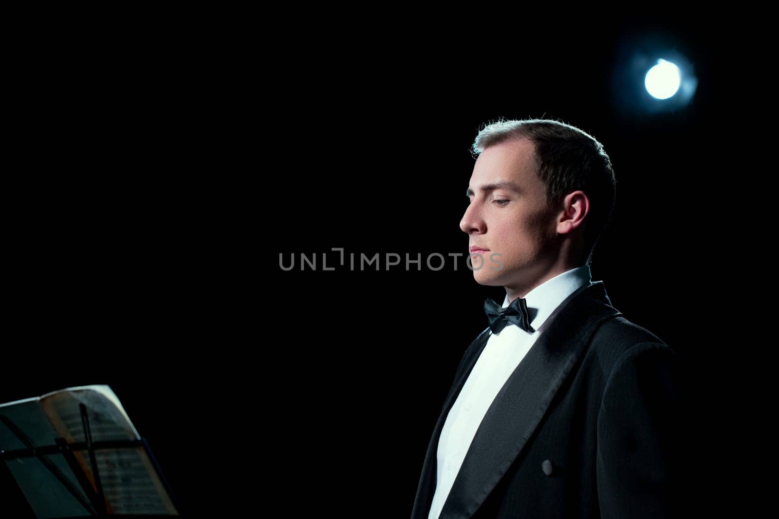 Image of music conductor focused before the show by rivertime