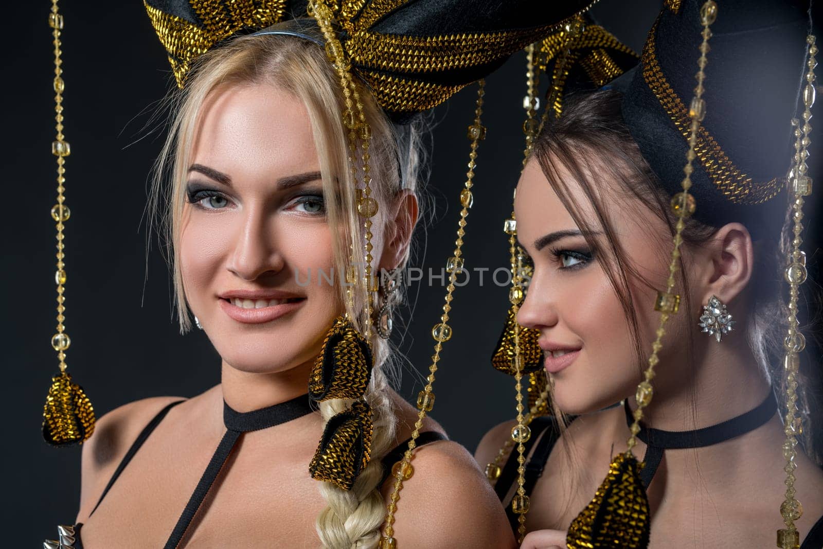 Image of sexy dancers in headdresses with tassels by rivertime
