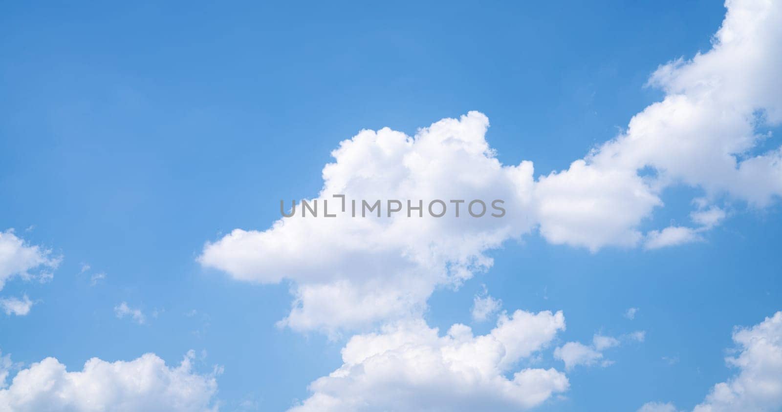 Beautiful blue sky and white cumulus clouds abstract background. Cloudscape background. Blue sky and fluffy white clouds on sunny days. Beautiful blue sky. World Ozone Day. Ozone layer. Summer sky. by Fahroni