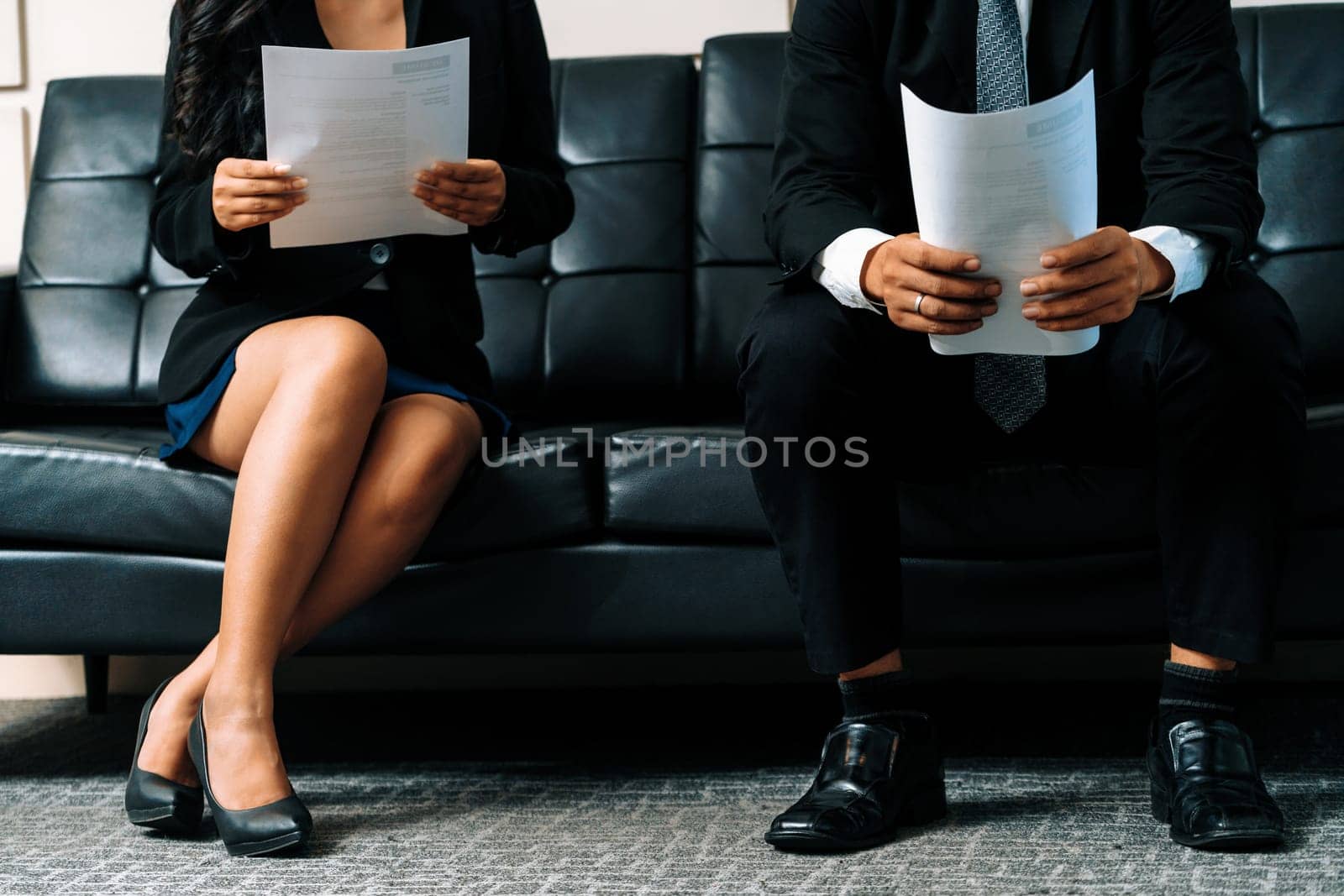Stressed businessman and businesswoman candidate sit and wait for interview at the company office. Job application, business recruitment and Asian labor hiring concept. uds