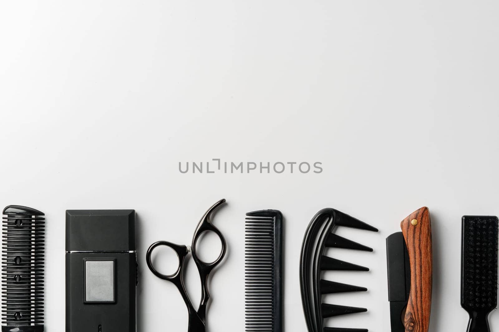 Set of barber tools for haircut on gray background flat lay by Fabrikasimf
