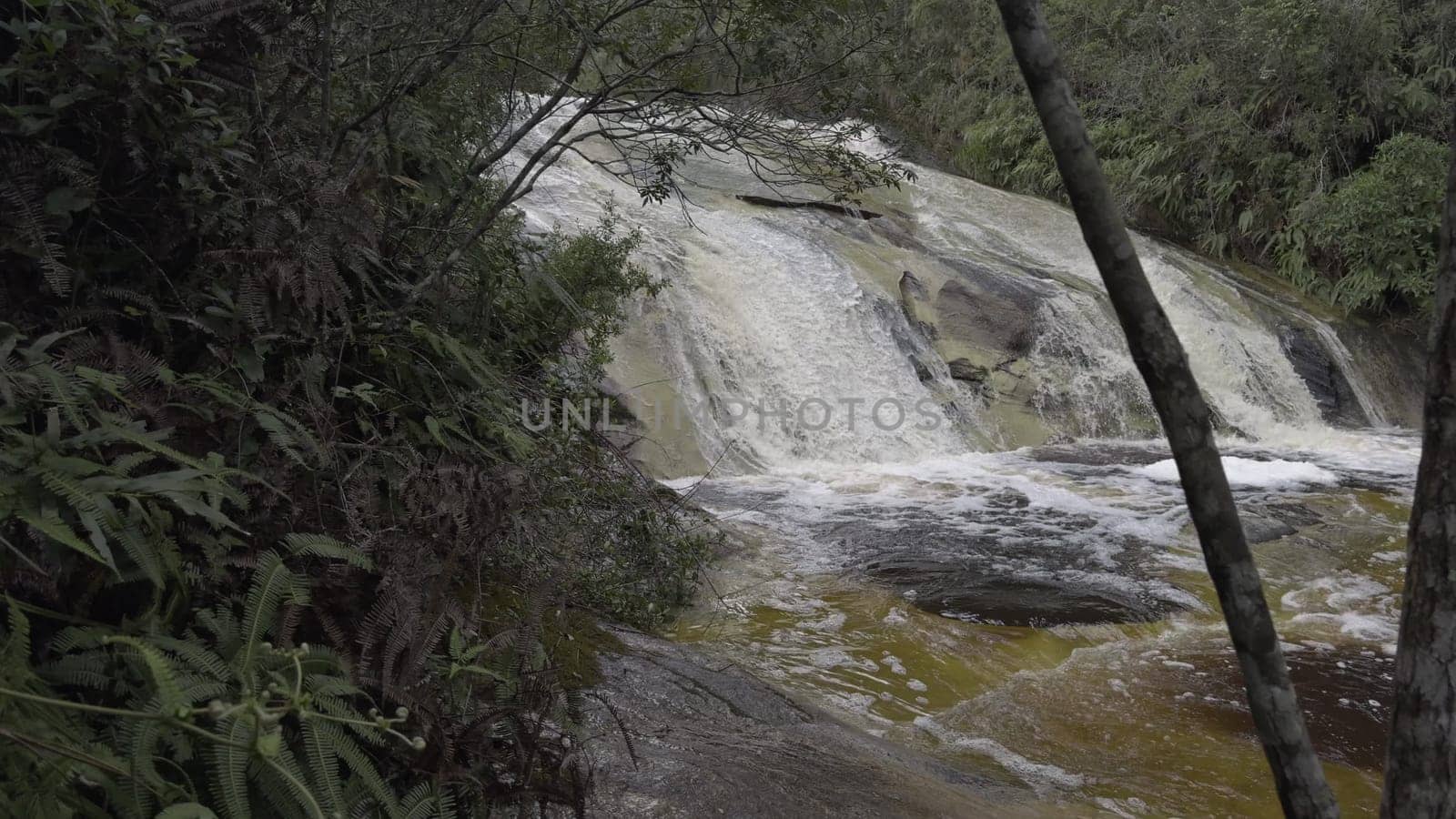 Slow Motion Video Approaching Waterfall in Lush Jungle by FerradalFCG