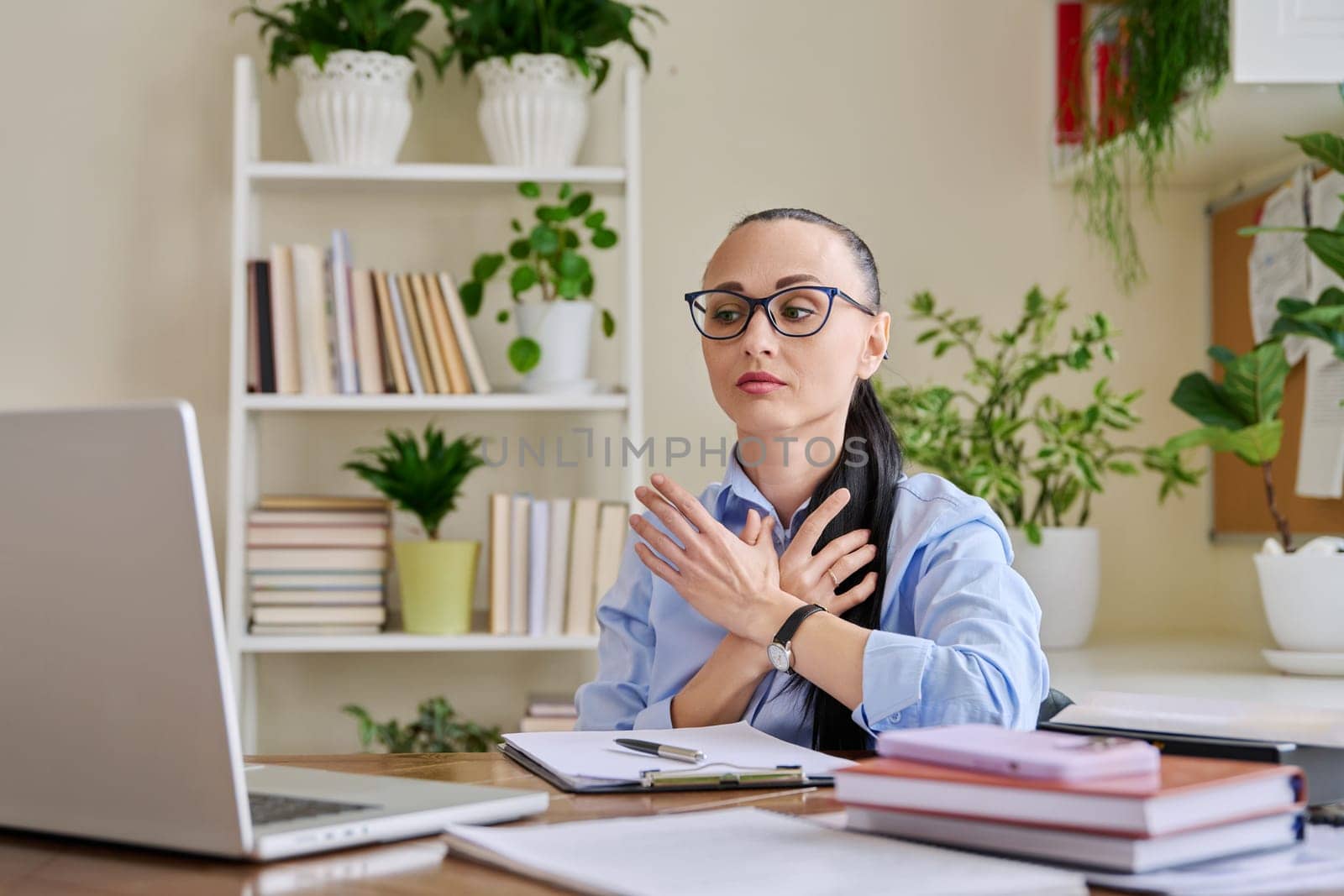 Woman psychologist mental therapist working remotely using computer for online therapy by VH-studio