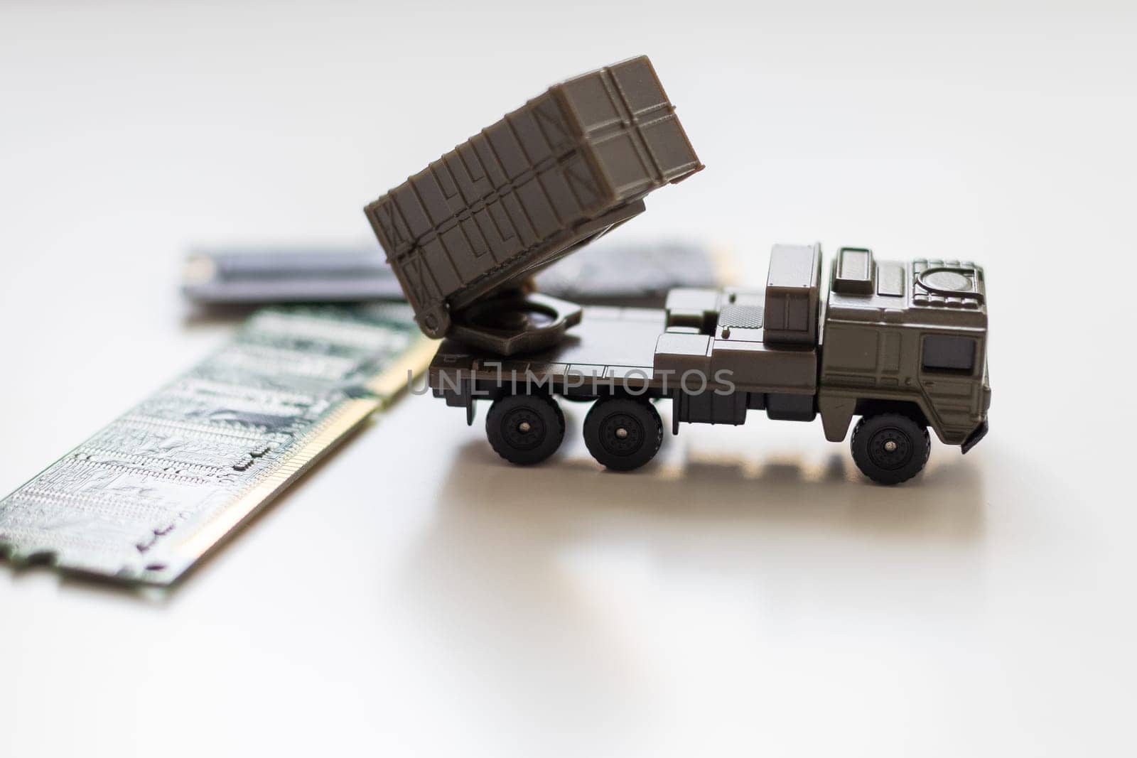 A toy military vehicle with a rocket and microcircuit. High quality photo