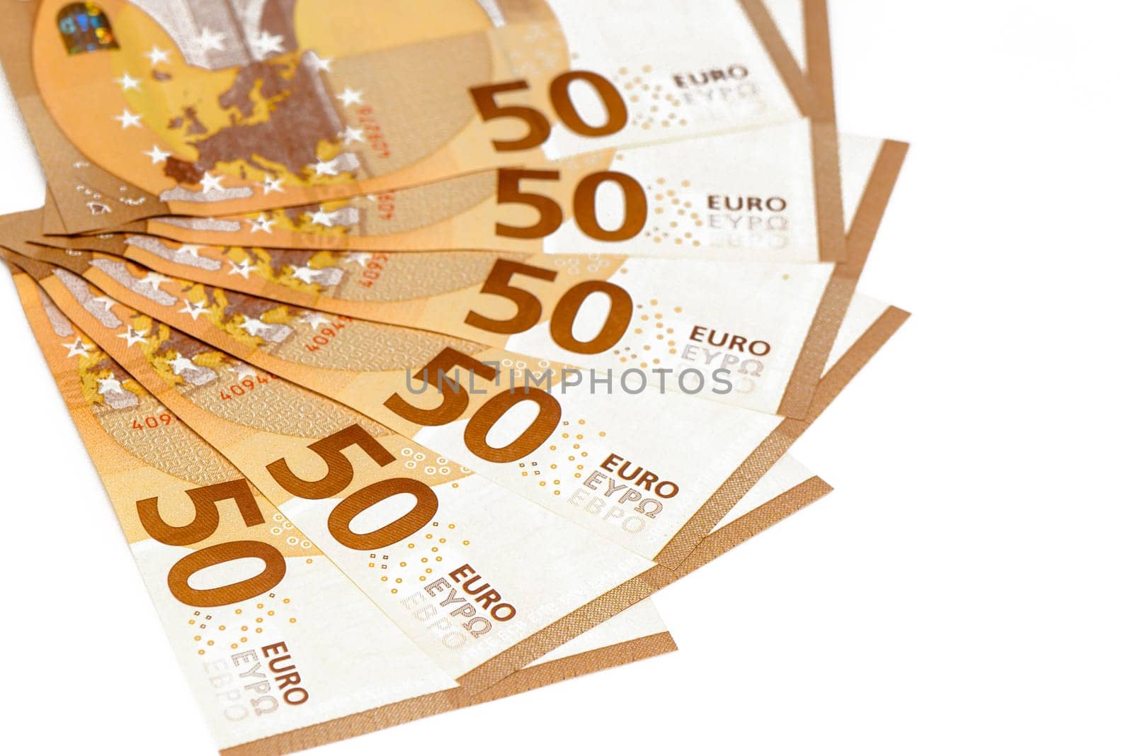 Concept of many euros: a pile of 50-euro bills lying on a white background. Many 50 € bills isolated on white background. by Mixa74