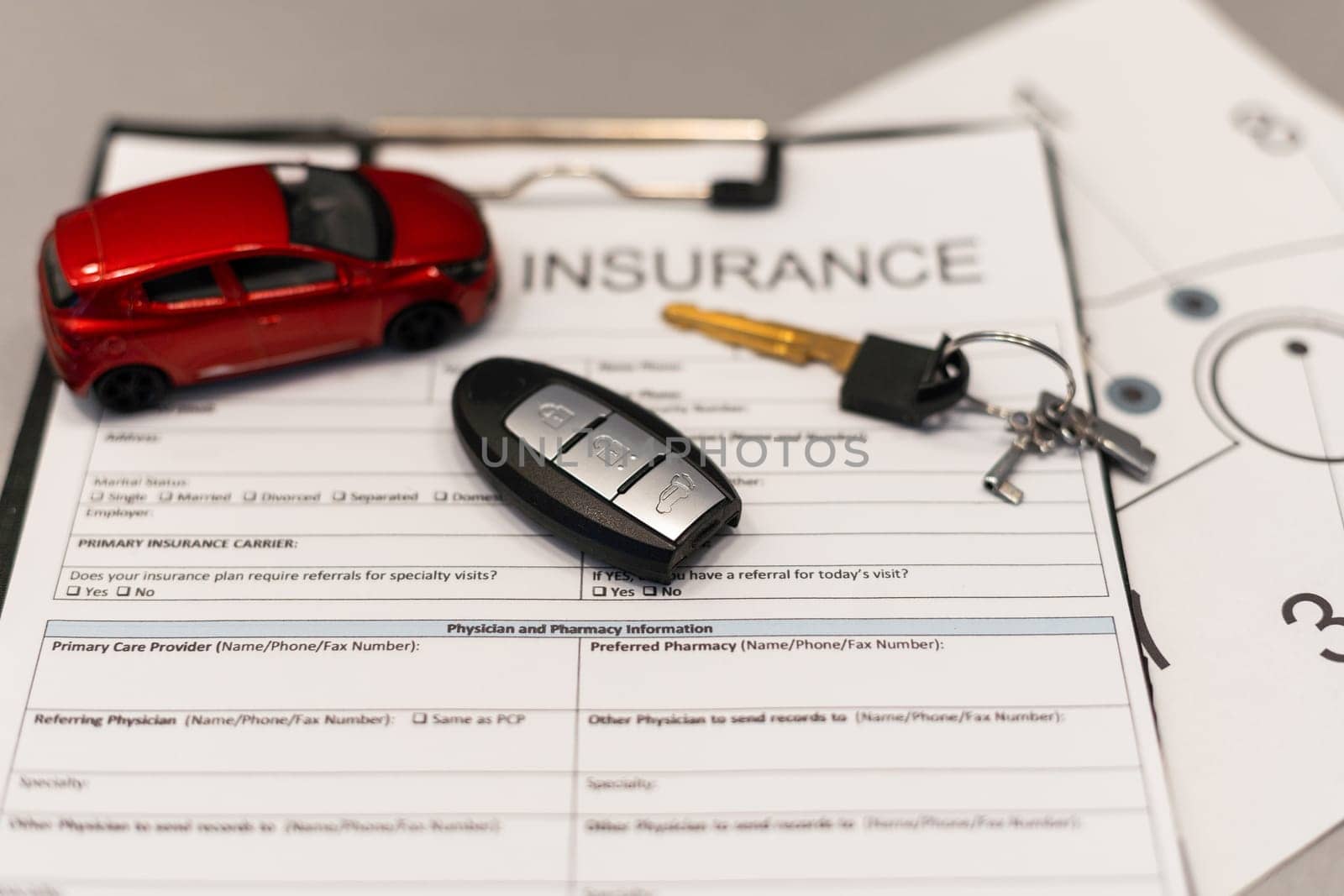 Car insurance form with car key. High quality photo