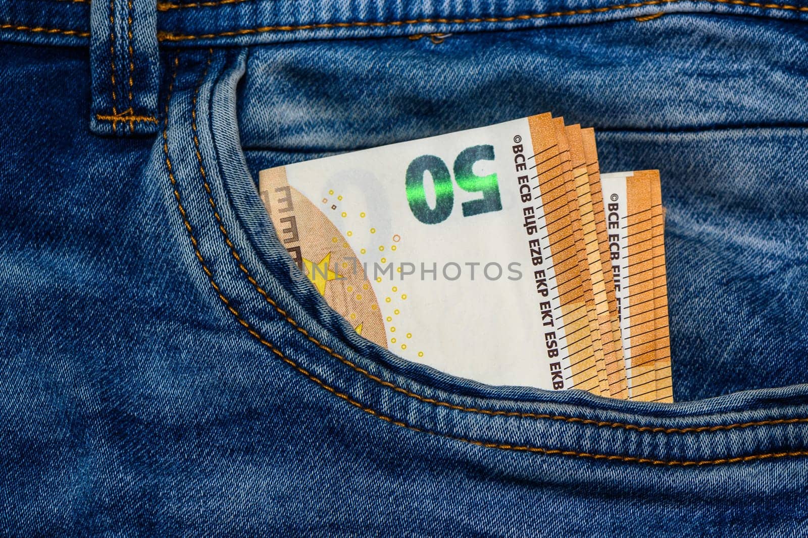 Concept of financial problems, last money. 50 euro banknote in jeans pocket. by Mixa74