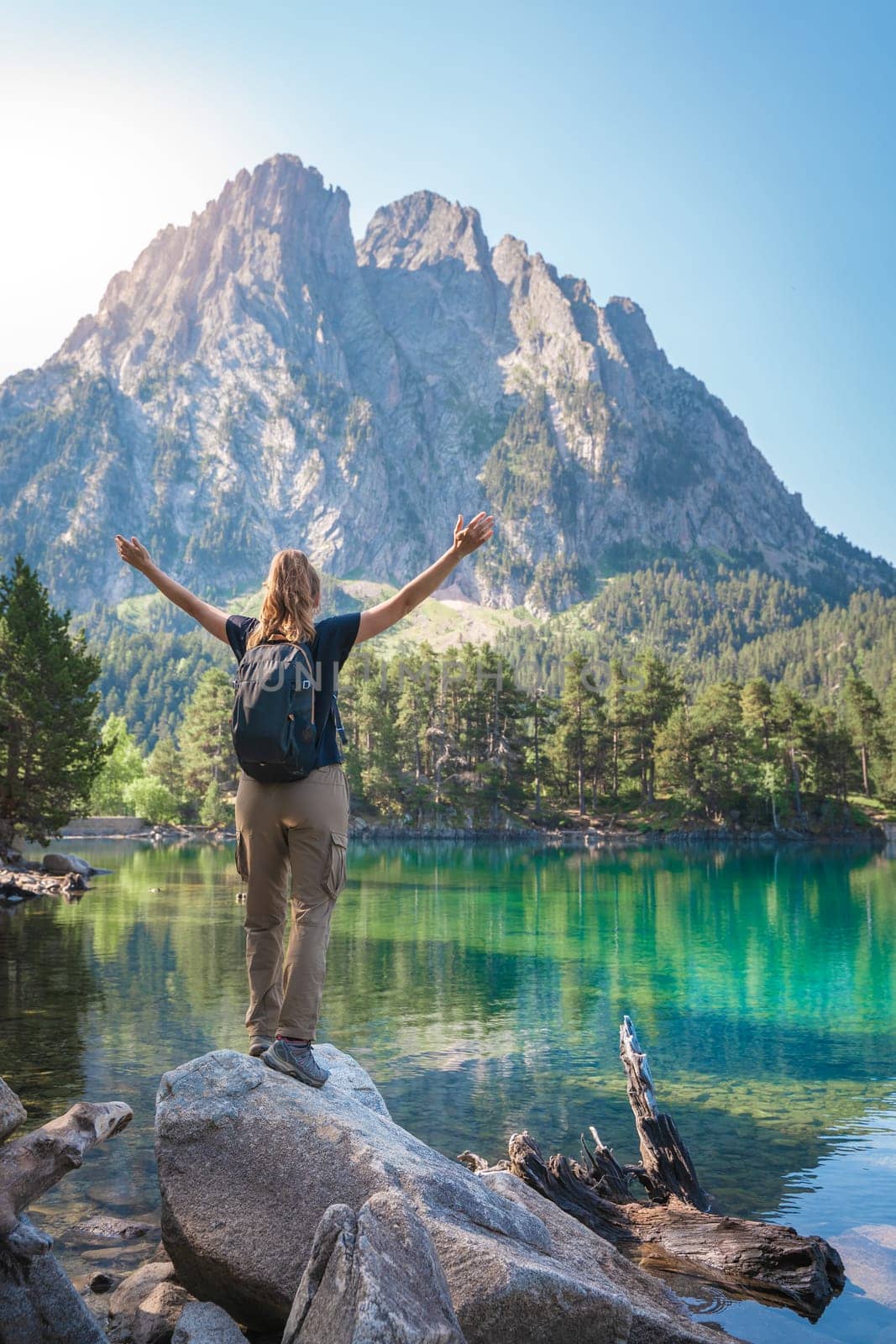 Young Attractive Woman With Open Arms hiking in a Beautiful Lake in summer. Discovery Travel Destination Freedom Concept High quality photo