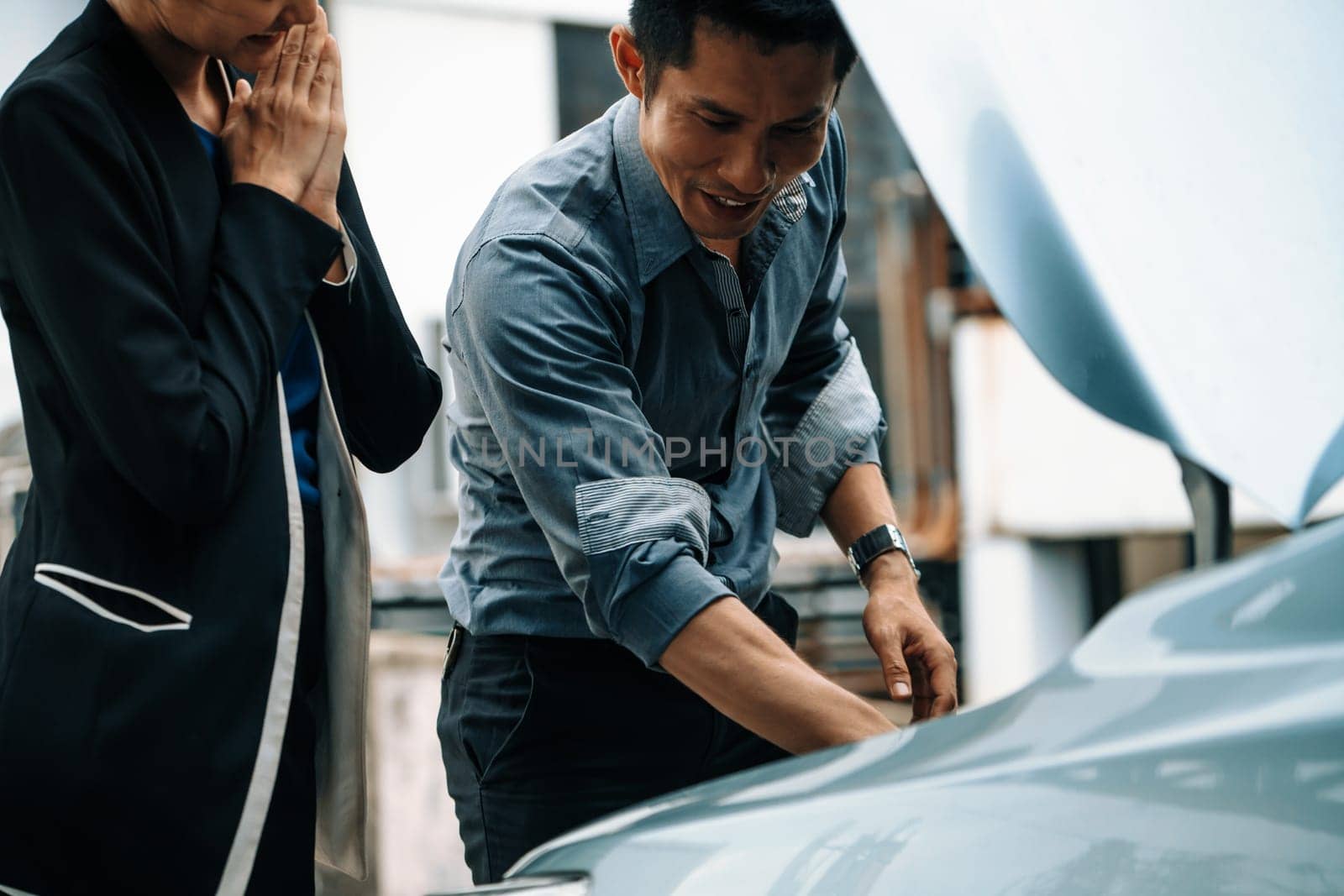 Man help woman fix the car problem. uds by biancoblue