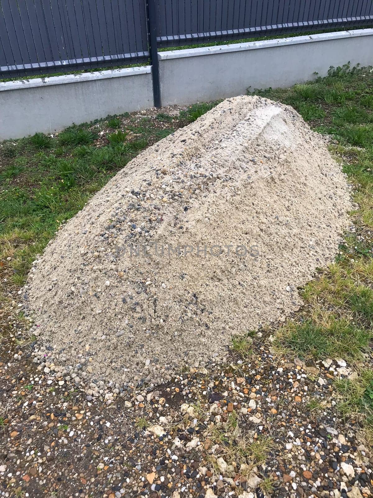 A pile of construction material at the building, White gravel for construction works by FreeProd