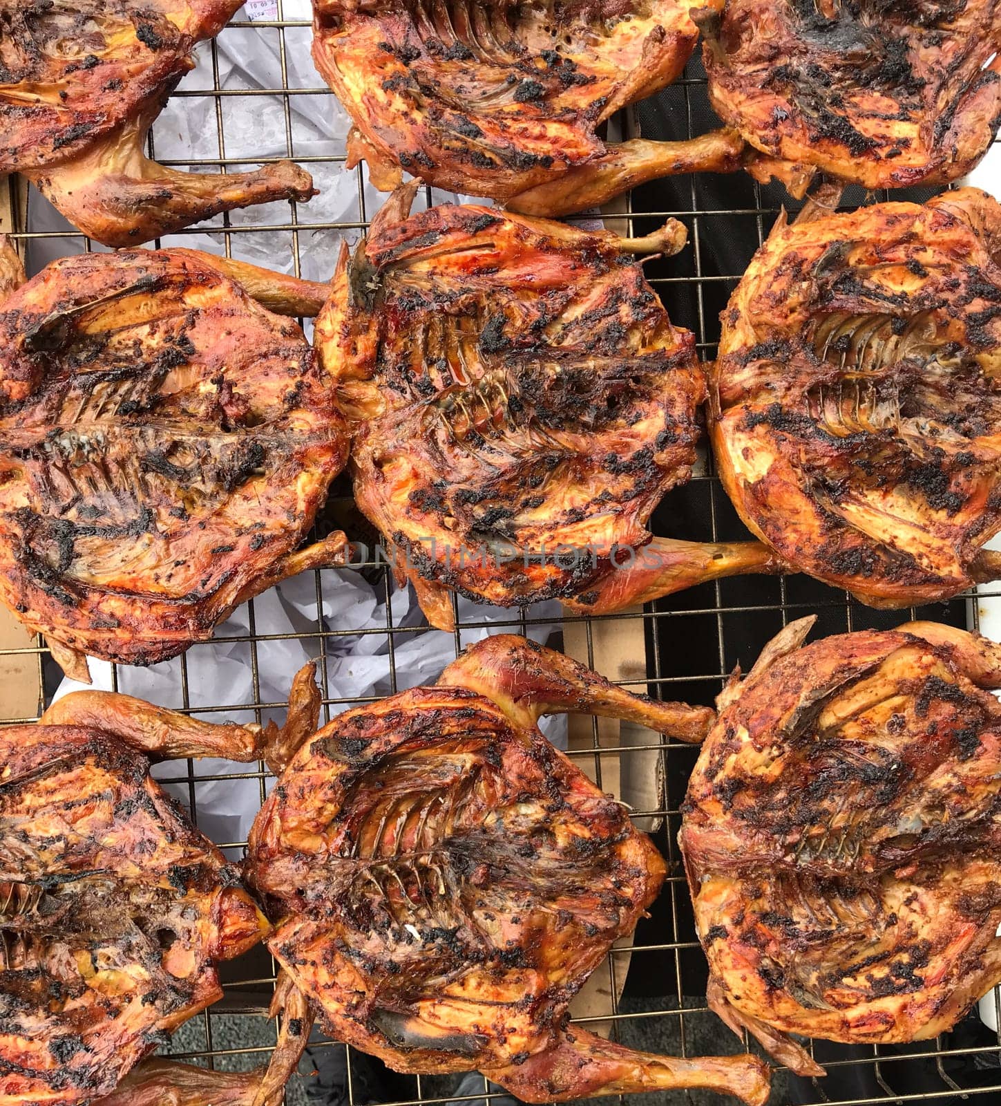 Delicious chickens wings and lamb barbecue on hot grill. High quality photo