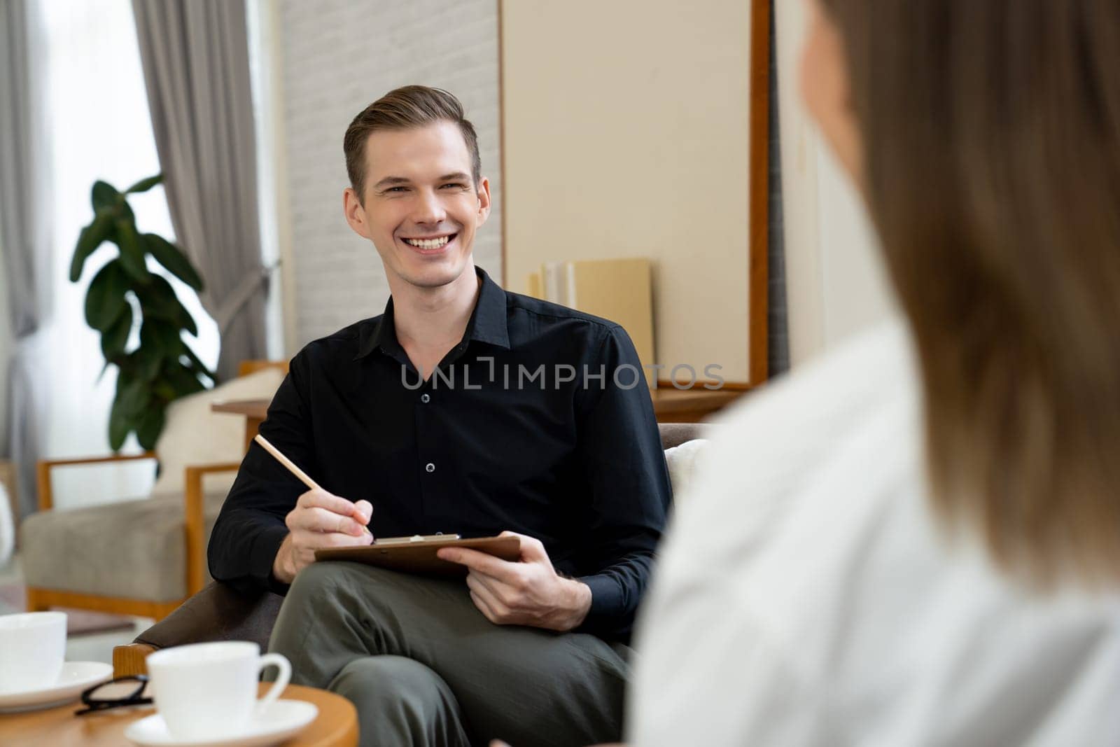 Psychological consultation gaining improvement on mental problem, happy young female patient doing therapy session while psychiatrist making diagnostic on mental illness. Unveiling