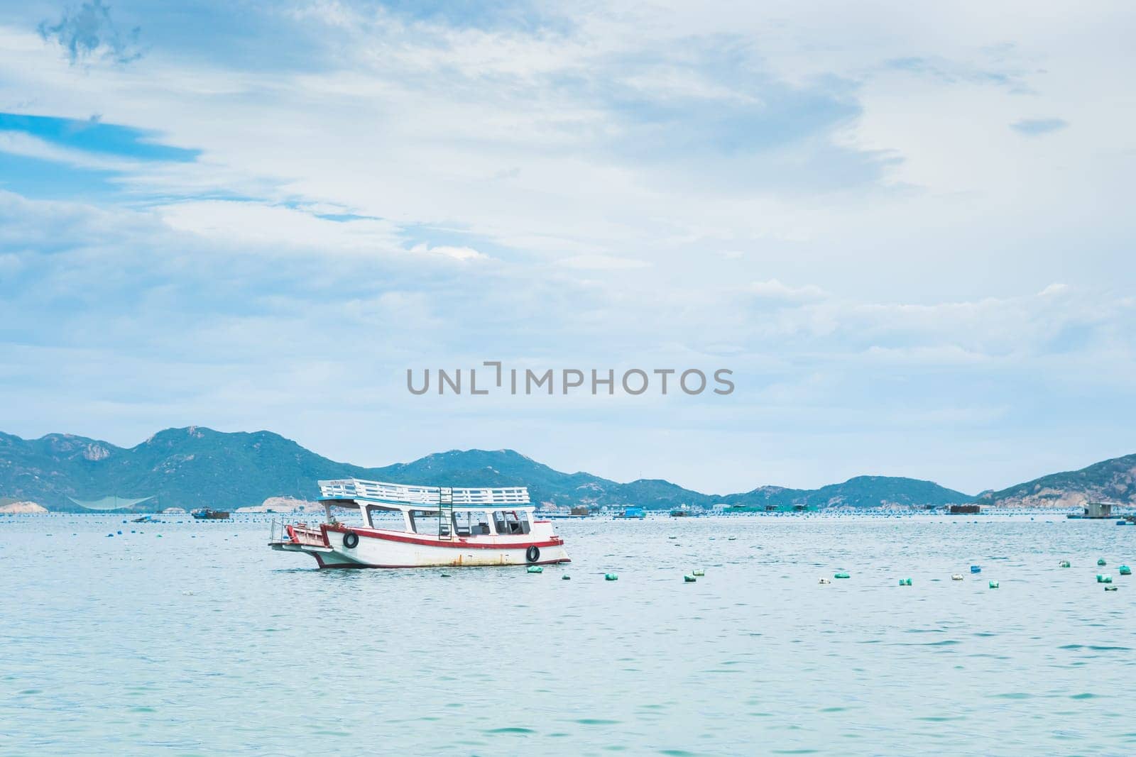 Beautiful sea landscape panorama. Green forested mountains island . Fishing boats near beach. Nature background. Tranquility calm ocean relax energy by nandrey85