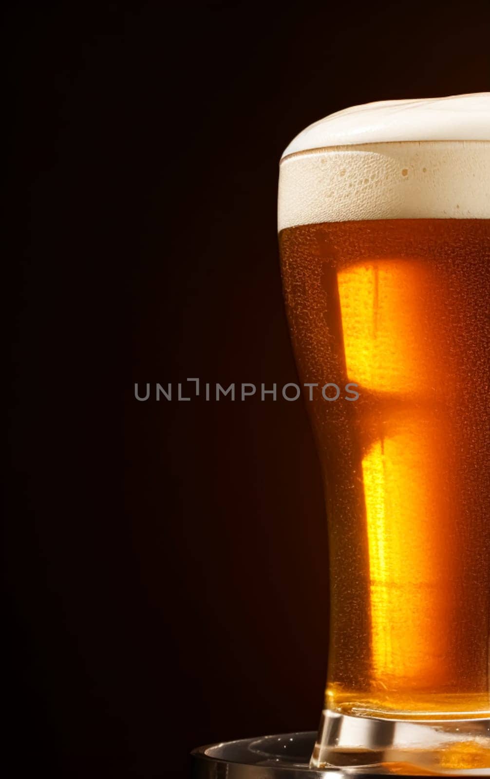 Glass of cold beer with foam, pint of original premium beer drink, alcohol flavour and holiday celebration idea