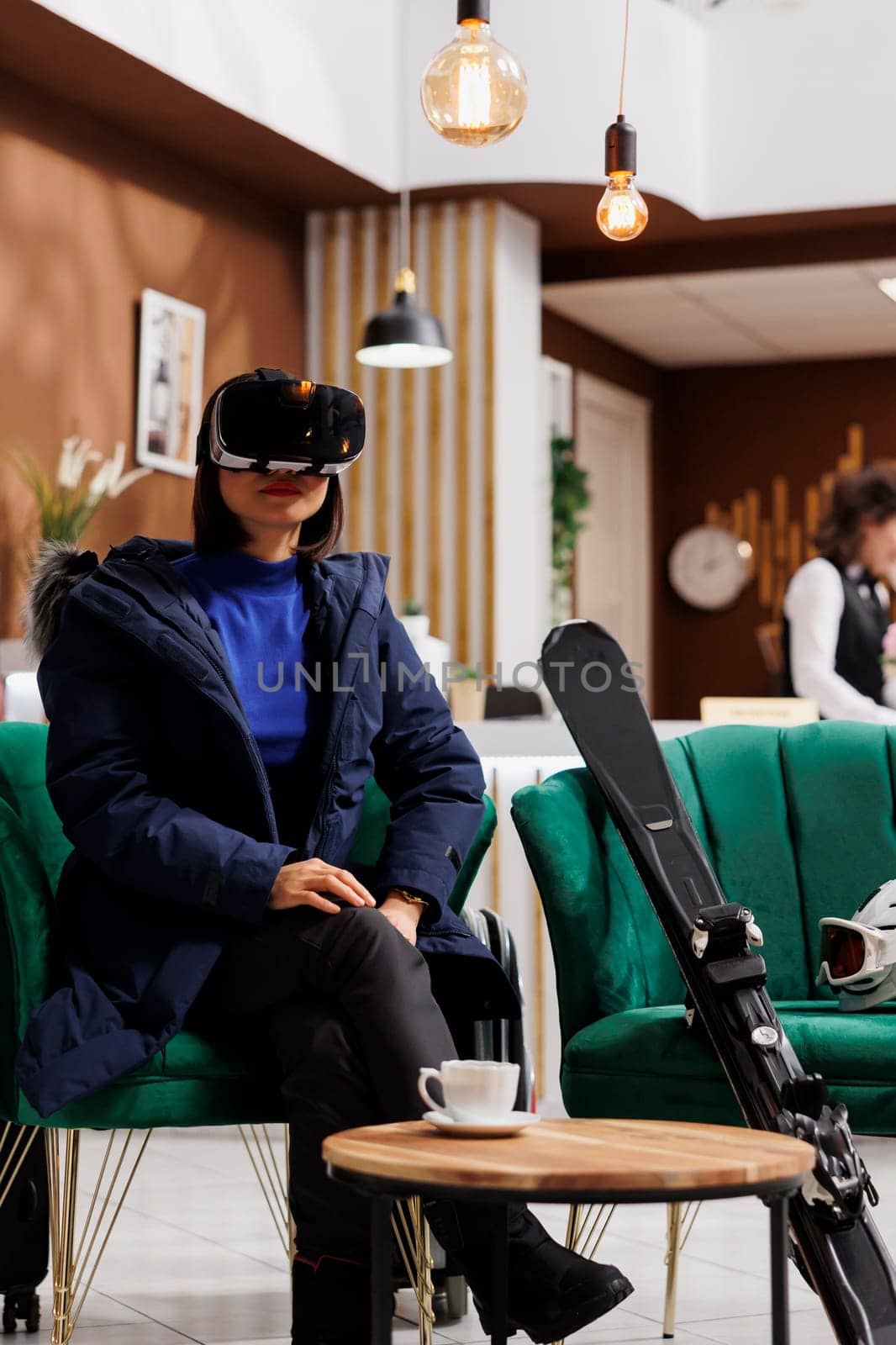 Woman with vr glasses in hotel reception by DCStudio