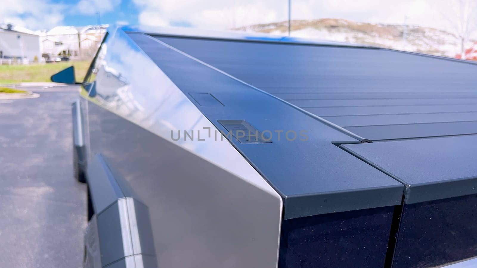 Close-Up Detail of Tesla Cybertruck’s Roof and Angular Body Design by arinahabich