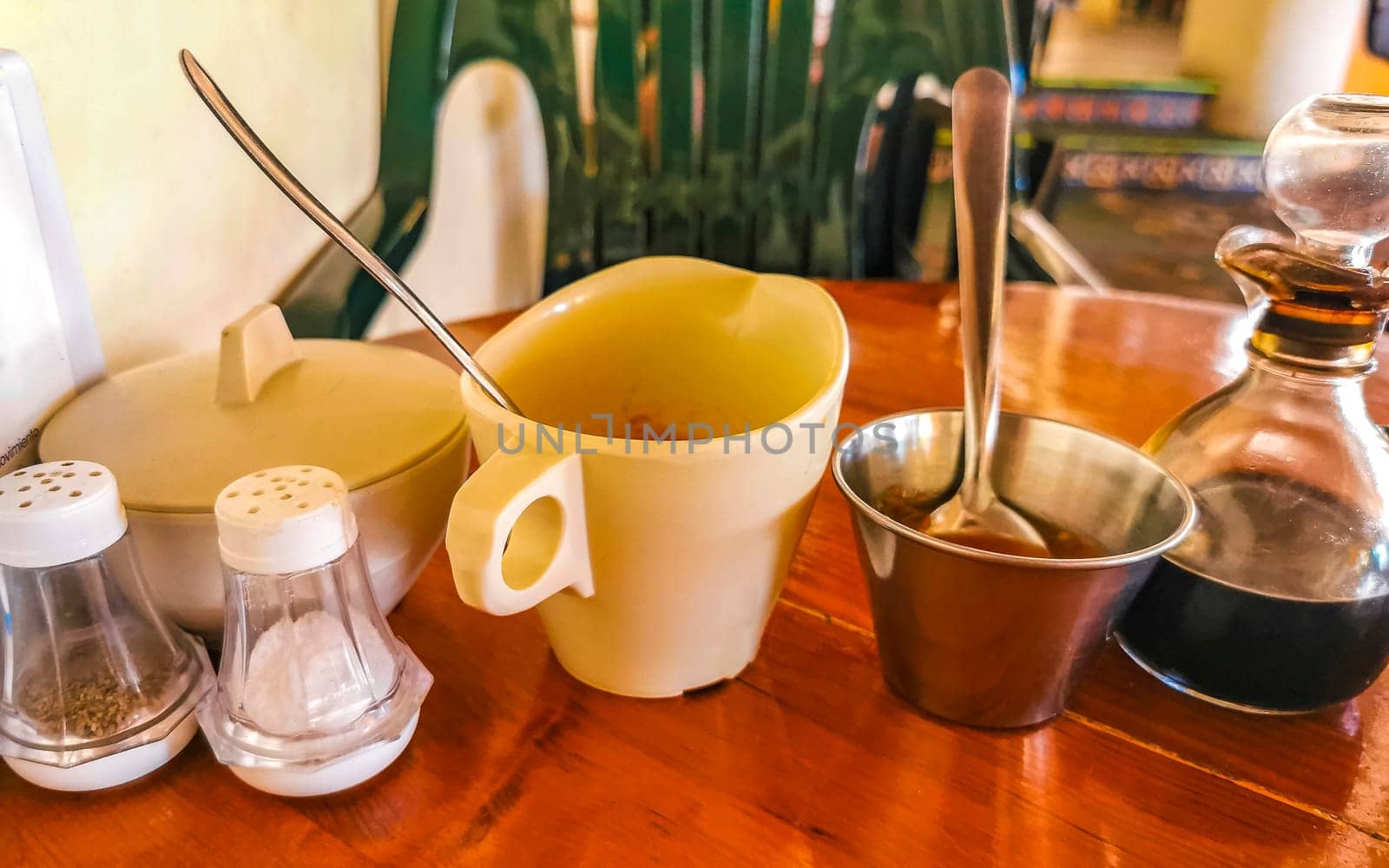 Sugar salt and pepper shaker and different sauces in restaurant in Zicatela Puerto Escondido Oaxaca Mexico.