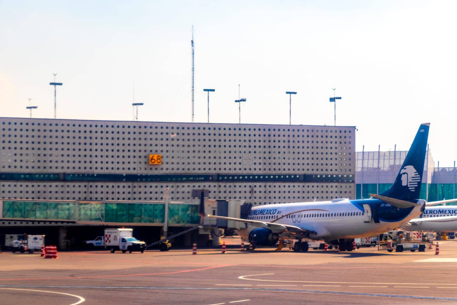 Aircraft at the airport Building and runway Aeropuerto Internacional Benito Juarez in Penon de los Banos Venustiano Carranza Mexico City Mexico.