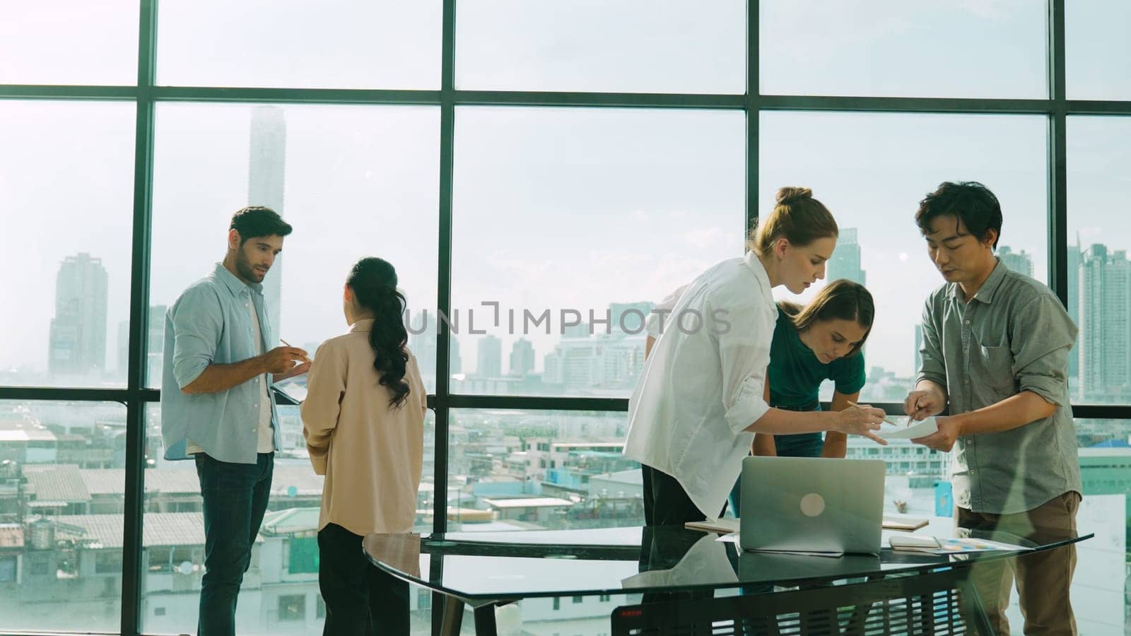 Group of diverse business people brainstorming about marketing plan. Professional multicultural business team working, talking, presenting about financial strategy at modern office. Tracery