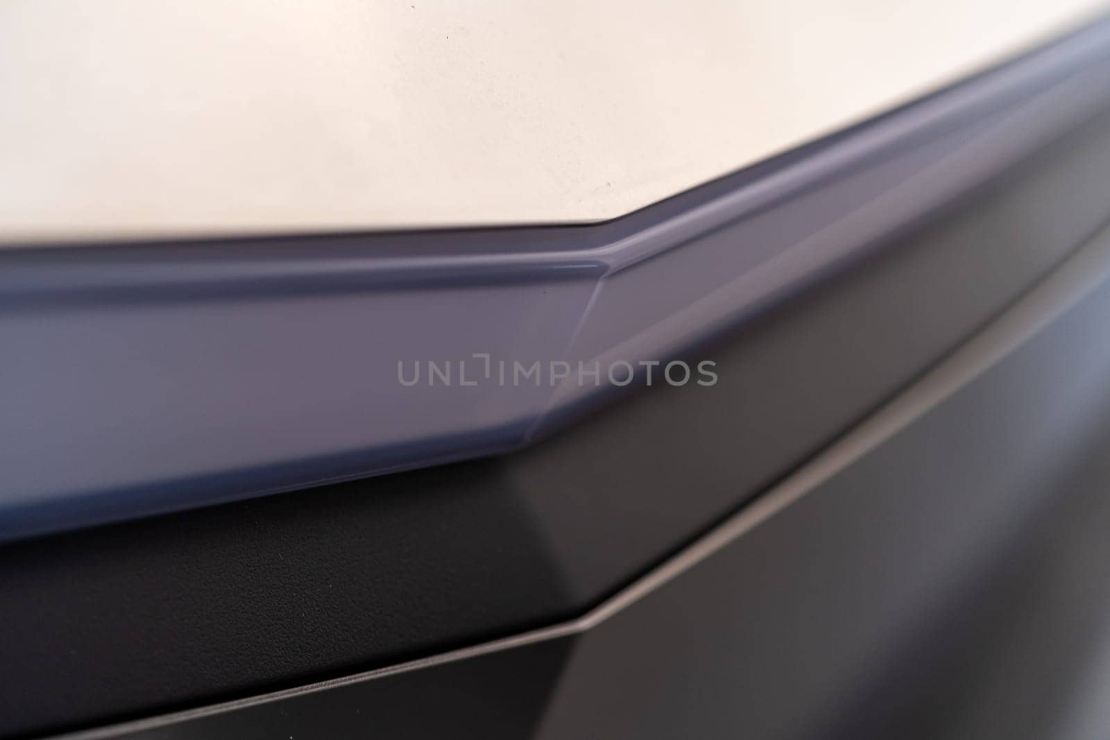 Denver, Colorado, USA-May 5, 2024-This image captures the streamlined and minimalistic design detail of the Tesla Cybertruck exterior, focusing on the sleek and subtle curvature that showcases the futuristic aesthetic of this innovative electric vehicle.