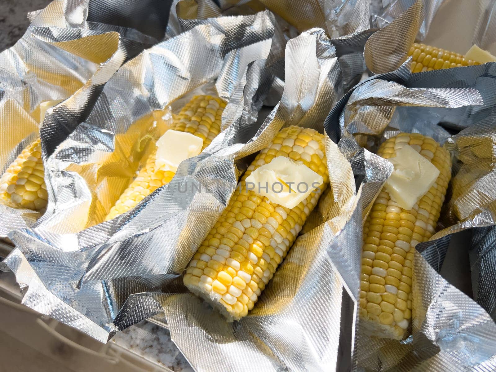 Fresh Corn on the Cob in Vacuum-Sealed Packaging by arinahabich