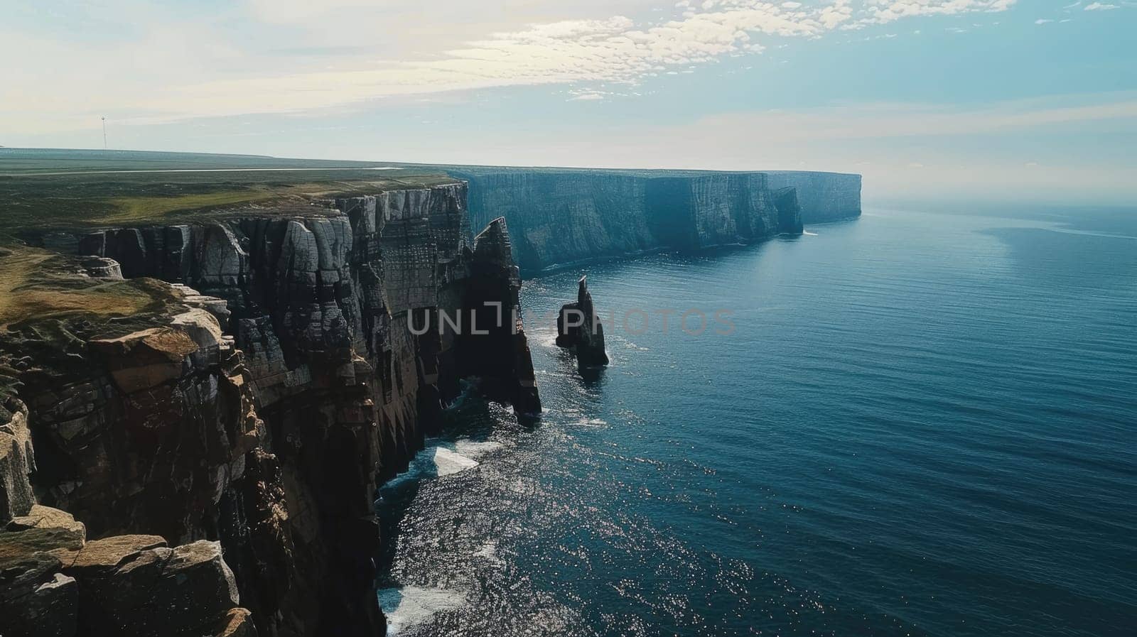 A stunning aerial view of a cliff by the ocean, where the fluid water meets the natural landscape, creating a picturesque and tranquil scene under the open sky AIG50
