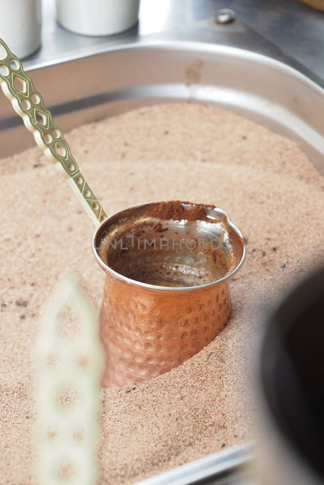 top view of making traditional turkish coffee on sand