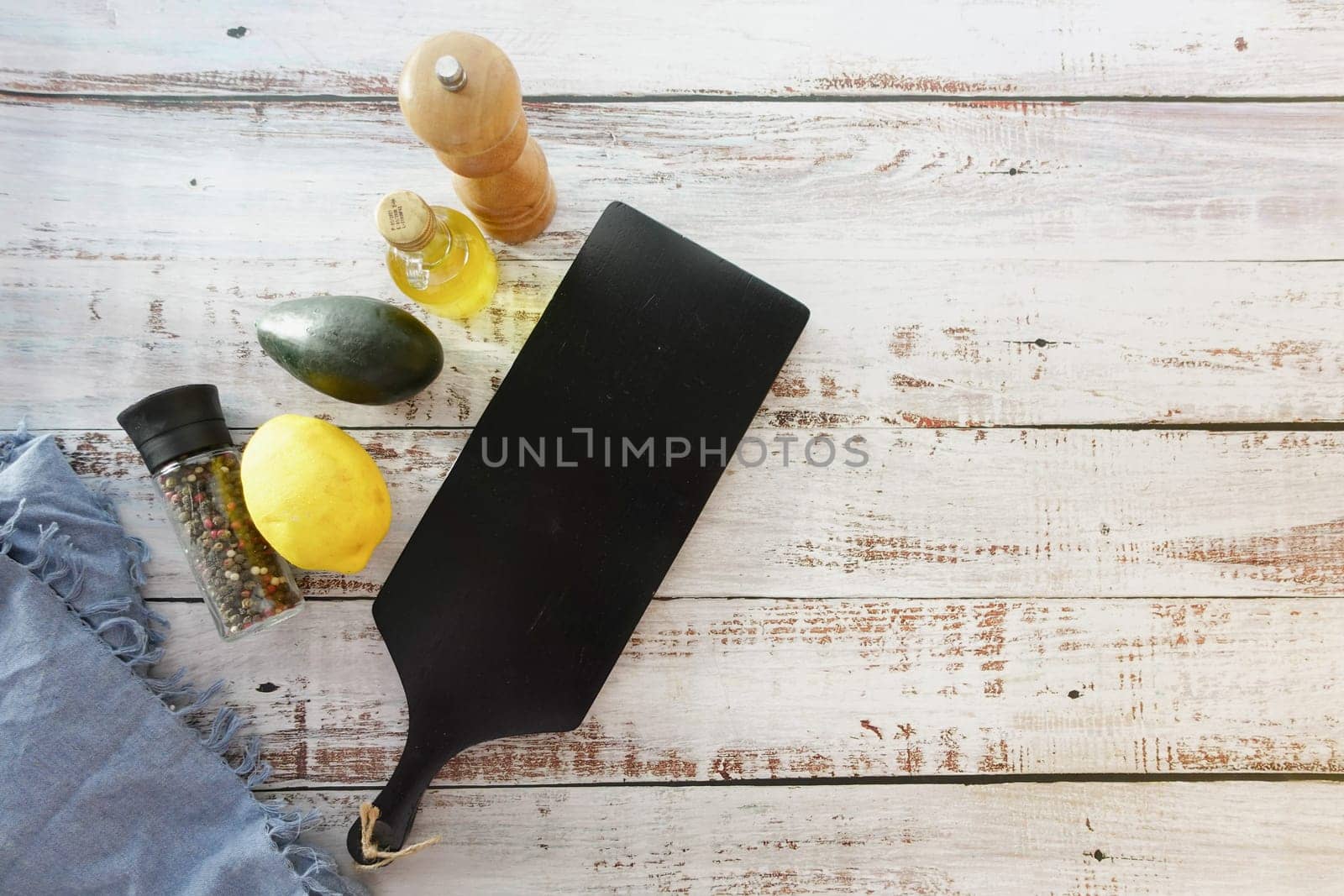wooden chopping board on table with copy space by towfiq007